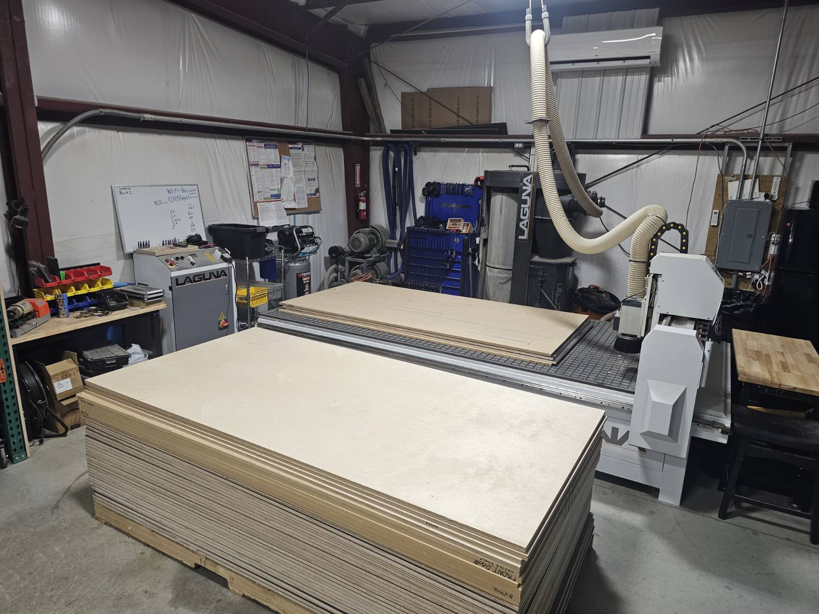 NCG CNC router cutting cabinet components from birch plywood in our production shop